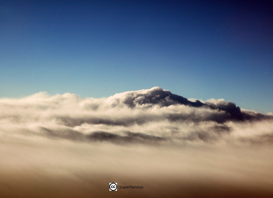 Cloud layer with blue sky above