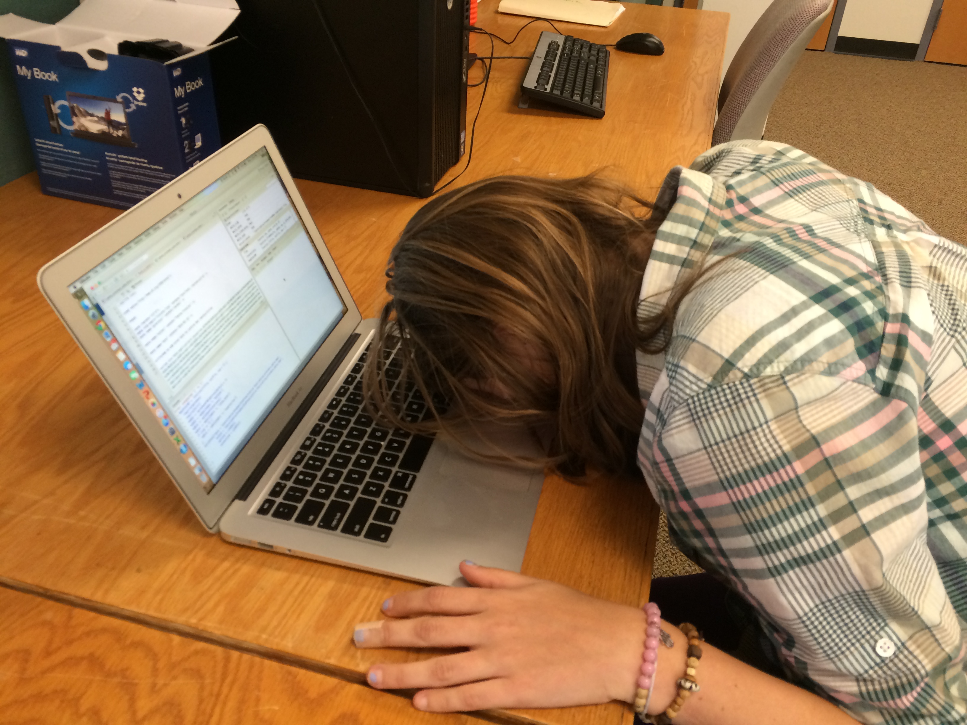 Student sleeping on computer
