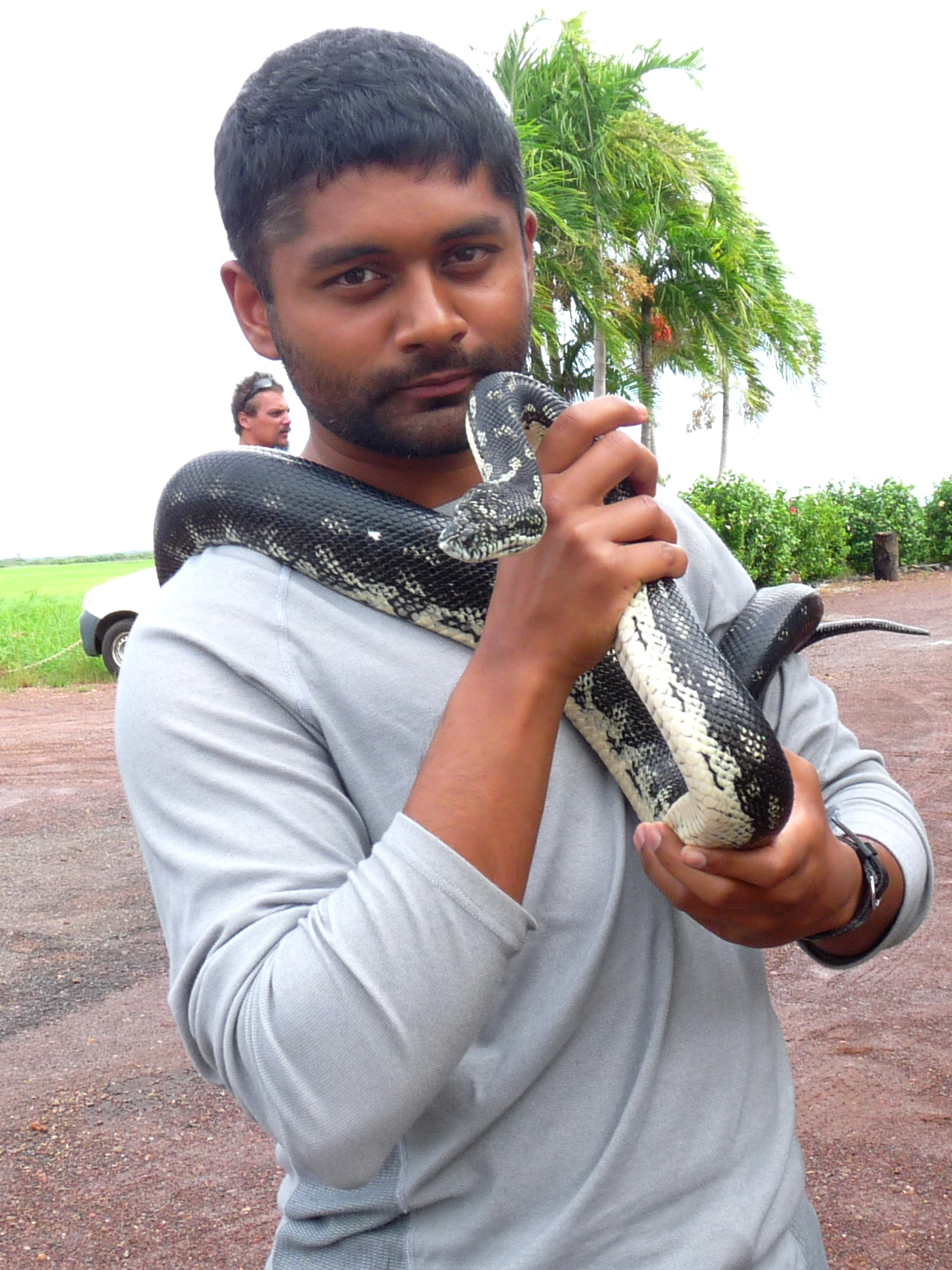 Vyas Dhaval holding large constrictor snake