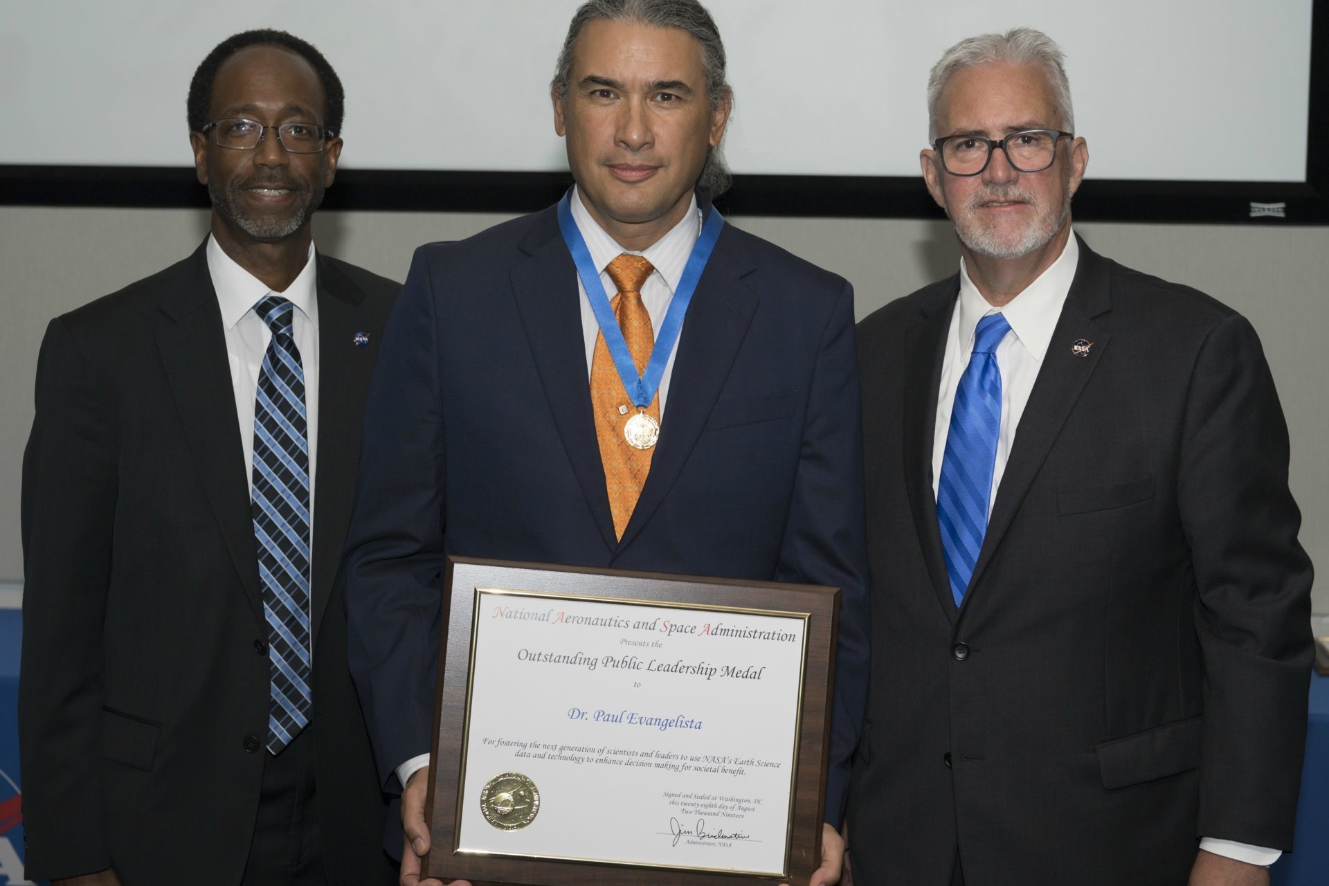 Paul Evangelista receiving the Outstanding Public Leadership Medal from NASA